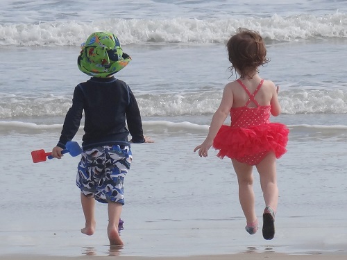 kids running on water waves beach activities spinnaker resorts blog